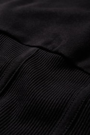 Dona - Dessuadora crop - negre