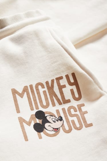 Dámské - CLOCKHOUSE - teplákové kalhoty - Mickey Mouse - krémově bílá