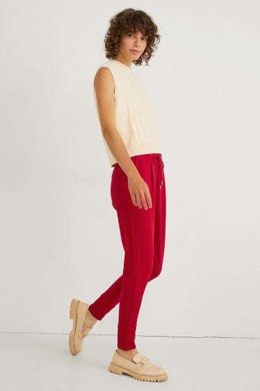 Dámské - Žerzejové kalhoty - tapered fit - červená