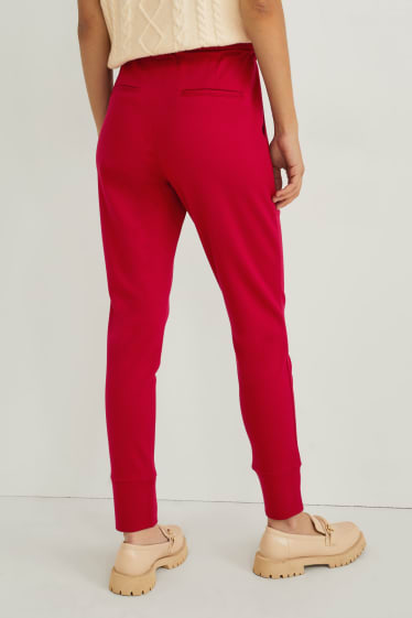 Dámské - Žerzejové kalhoty - tapered fit - červená