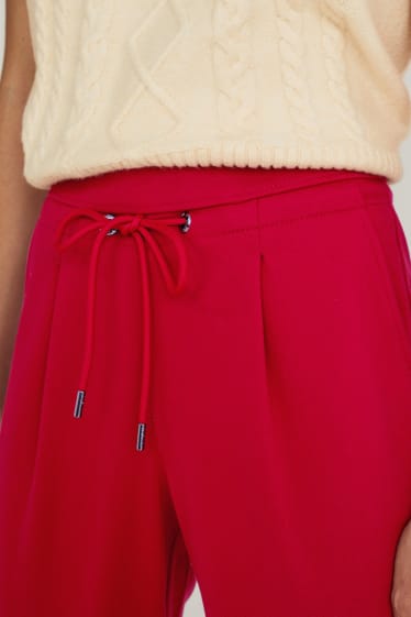 Dámské - Žerzejové kalhoty - tapered fit - červená