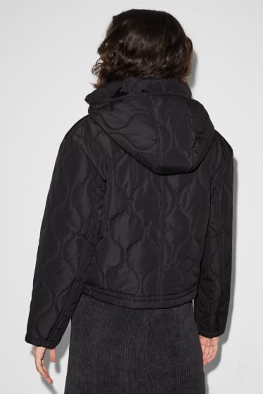 Dospívající a mladí - CLOCKHOUSE - prošívaná bunda s kapucí - černá