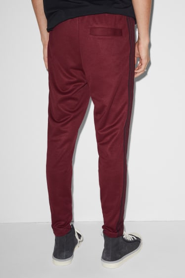 Hommes - CLOCKHOUSE - pantalon de jogging - rouge foncé