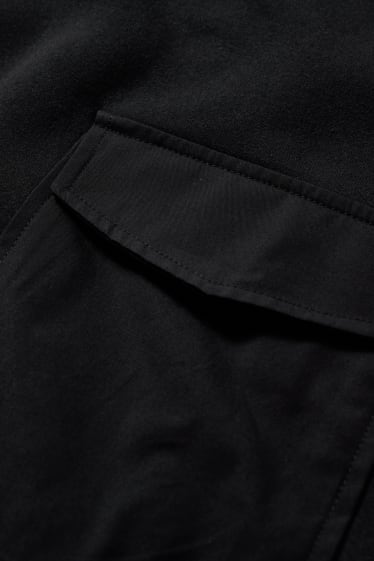 Dona - CLOCKHOUSE - dessuadora amb caputxa crop - negre