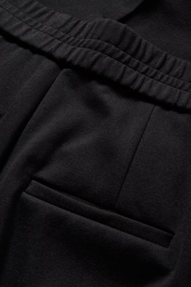 Dámské - Žerzejové kalhoty - tapered fit - černá