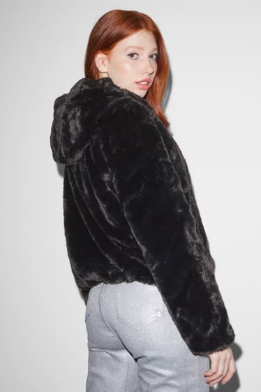 Femmes - CLOCKHOUSE - veste en imitation fourrure avec capuche - noir