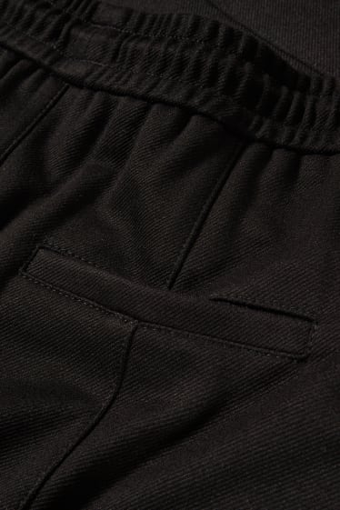 Dames - Pantalon - mid waist - tapered fit - zwart