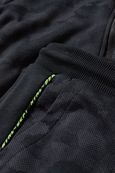 Niños - Set - sudadera con cremallera y pantalón de deporte - 2 piezas - con estampado - negro