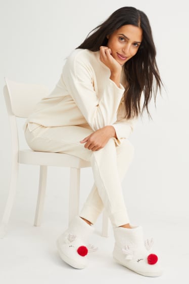 Femmes - Chaussons en finition bouclé - beige