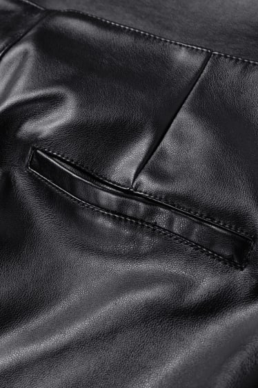 Dona - Pantalons - high waist - flared - pell sintètica - negre