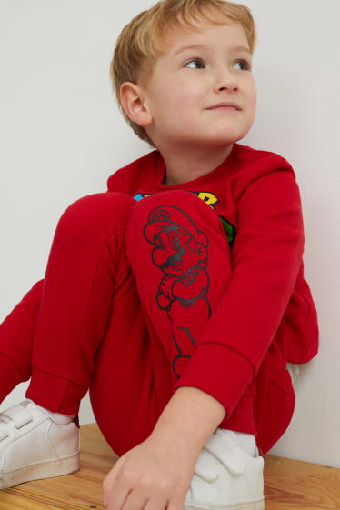 Dětské - Super Mario - teplákové kalhoty - červená