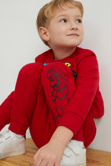 Děti - chlapci - Super Mario - teplákové kalhoty - červená