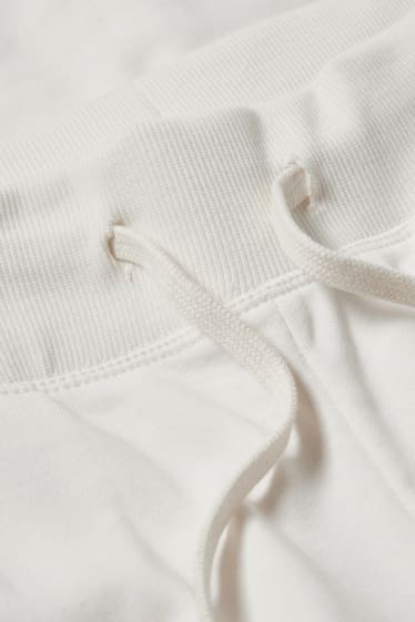 Dámské - Teplákové kalhoty basic - krémově bílá