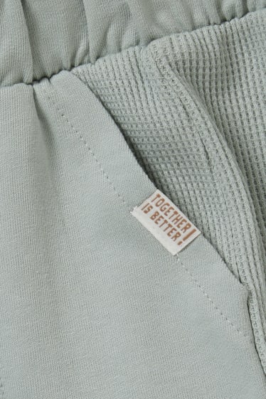 Miminka - Teplákové kalhoty pro miminka - mátově zelená