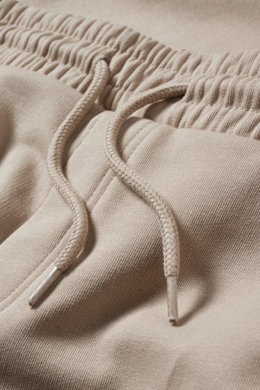 Uomo - Pantaloni sportivi - beige