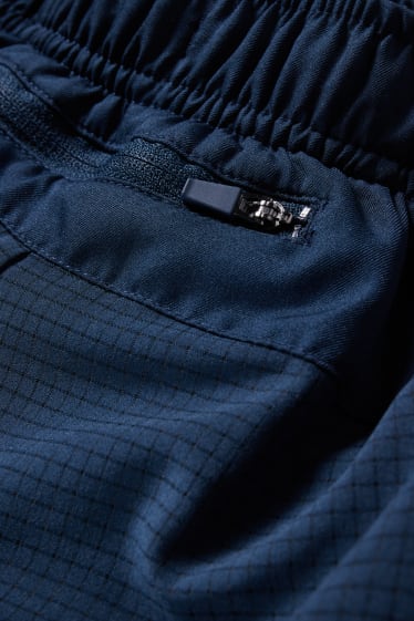 Home - Pantalons curts tècnics - blau fosc