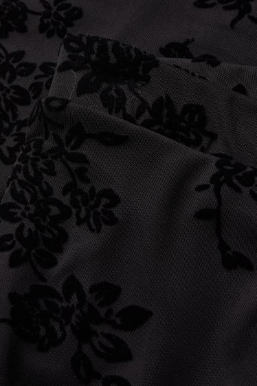 Dames - CLOCKHOUSE - broek van jersey - flared - gebloemd - zwart