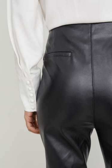 Dona - Pantalons - high waist - flared - pell sintètica - negre