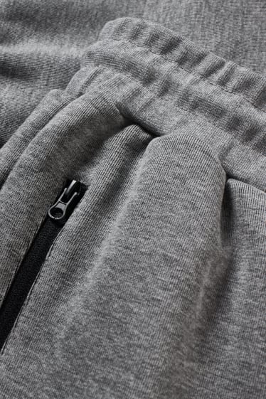 Pánské - Teplákové kalhoty  - šedá-žíhaná