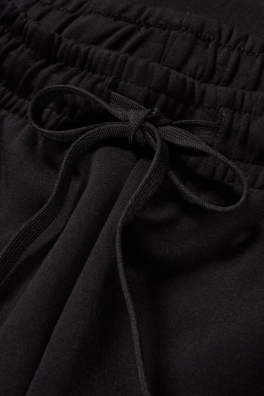 Dámské - Funkční teplákové kalhoty - training - 4 Way Stretch - černá