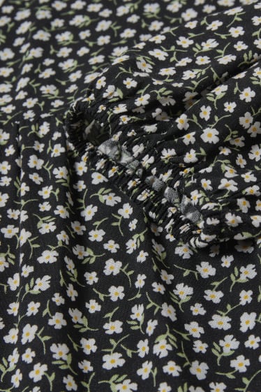 Jóvenes - CLOCKHOUSE - vestido de línea evasé - de flores - negro