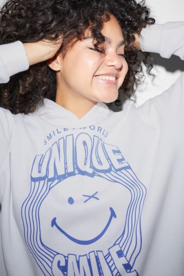 Ados & jeunes adultes - CLOCKHOUSE - sweat à capuche - SmileyWorld® - blanc