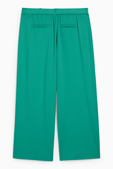 Dámské - Žerzejové kalhoty - flared - zelená