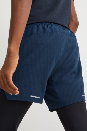 Home - Pantalons curts tècnics - blau fosc