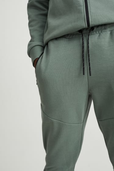 Pánské - Teplákové kalhoty  - zelená
