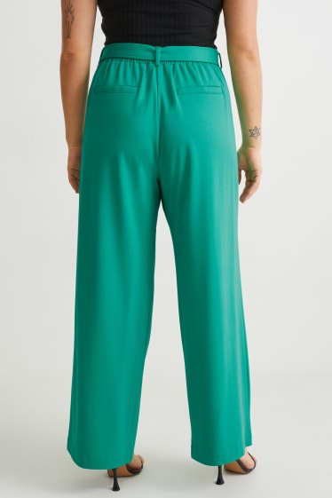 Dámské - Žerzejové kalhoty - flared - zelená