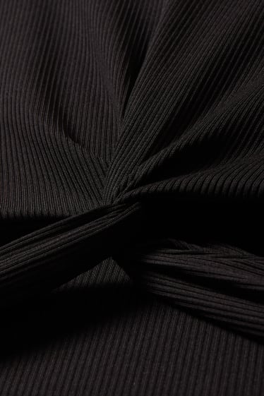 Joves - CLOCKHOUSE - samarreta crop - negre