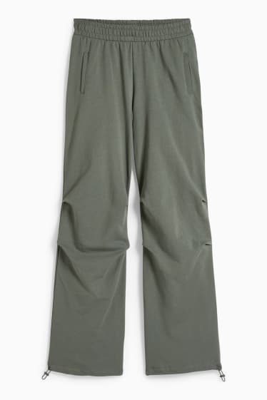 Nastolatki - CLOCKHOUSE - spodnie dresowe - zielony