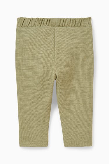 Niemowlęta - Niemowlęce spodnie dresowe - jasnozielony