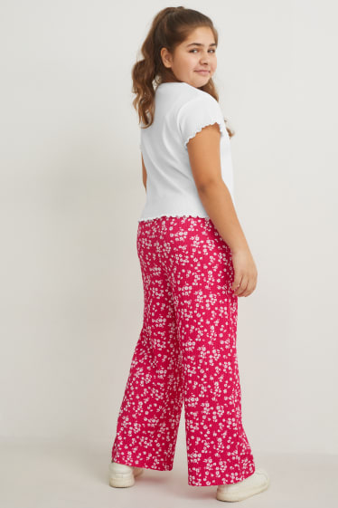 Nena - Talles esteses - conjunt - samarreta de màniga curta i pantalons - 2 peces - blanc/fúcsia
