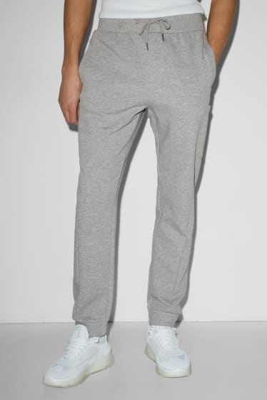 Uomo - Pantaloni sportivi - grigio melange