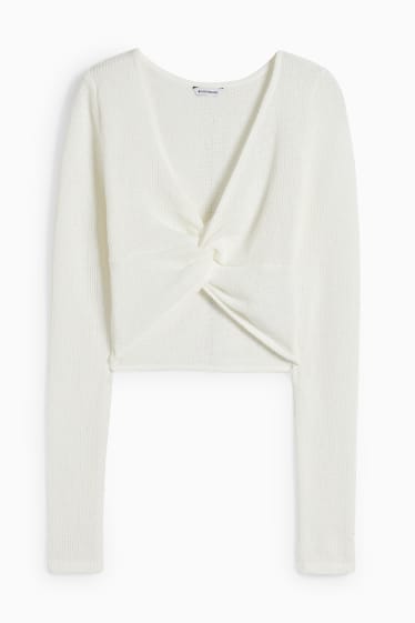 Dames - CLOCKHOUSE - korte longsleeve met knoop in de stof - crème wit