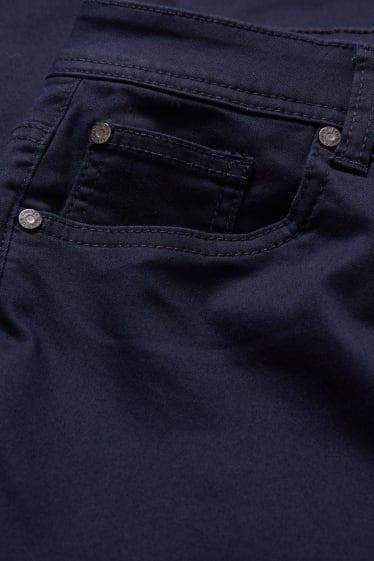 Dona - Pantalons de tela - mid waist - skinny fit - blau fosc
