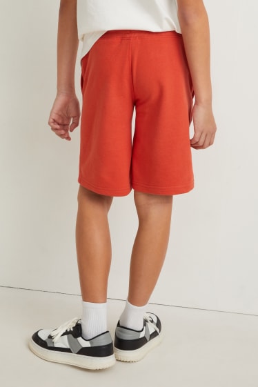 Dětské - Teplákové šortky - tmavě oranžová