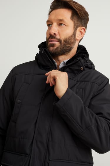 Hombre - Parka con capucha y adorno de pelo sintético - negro