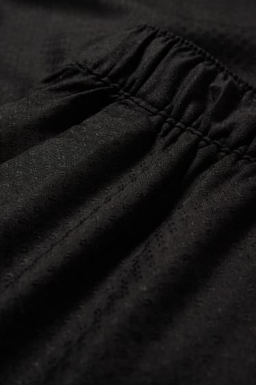 Dona - Pantalons de tela - mid waist - comfort fit - negre