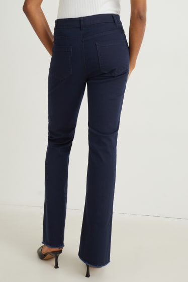 Dona - Pantalons de tela - high waist - flared - blau fosc