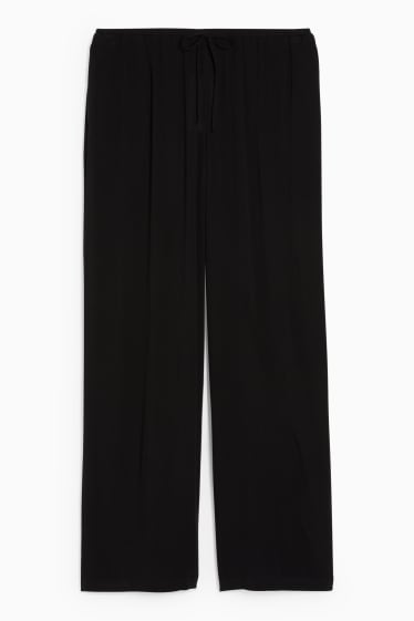 Dona - CLOCKHOUSE - pantalons de tela - mid waist - wide leg - negre