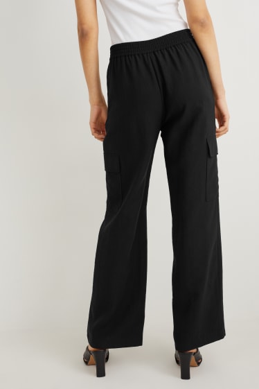 Dona - Pantalons de tela - high waist - palazzo - negre