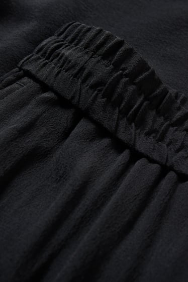 Donna - Pantaloni - vita media - palazzo - nero