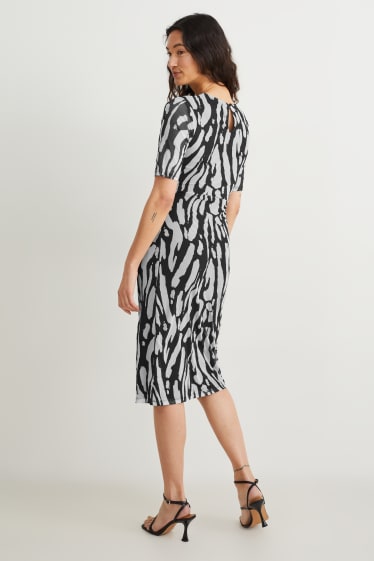 Dames - Nauwsluitende jurk met knoop in de stof - met patroon - zwart / grijs