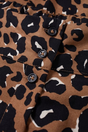 Dona - Faldilla - estampada - marró