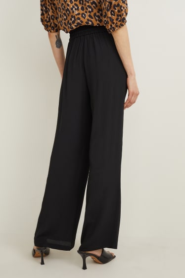 Women - Cloth trousers - mid-rise waist - palazzo - black