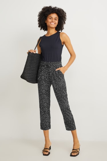 Dona - Pantalons de tela - high waist - tapered fit - estampats - negre