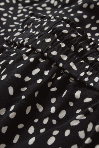 Dona - Pantalons de tela - high waist - tapered fit - estampats - negre