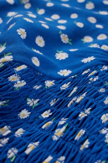 Dona - CLOCKHOUSE - brusa crop - de flors - blau fosc